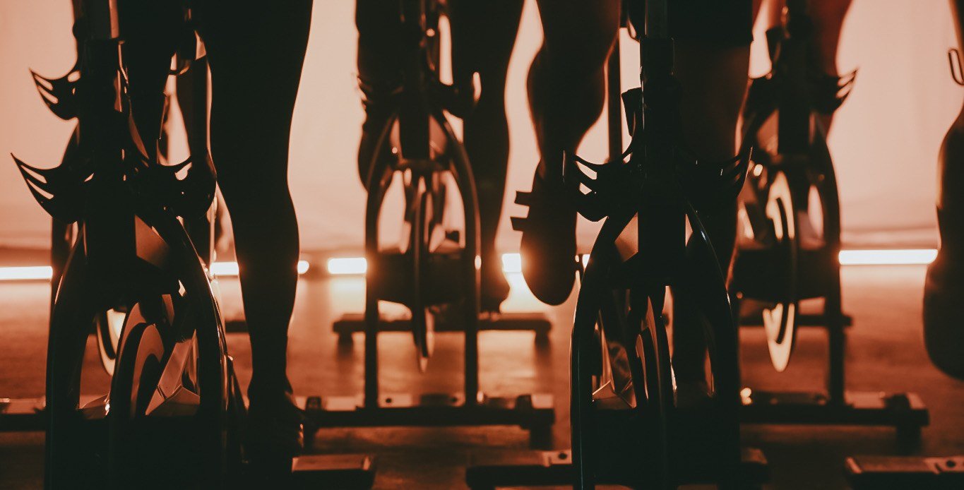 Warm candlelit indoor cycling class